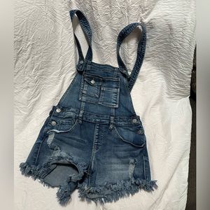 Short Blue Jean overalls with long straps.